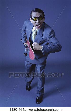 Middle-aged, excited, business, sunglasses, enthusiastic, Asian View Large Photo Image Stock Image - Middle-aged, excited, business, sunglasses, enthusiastic, Asian. Fotosearch