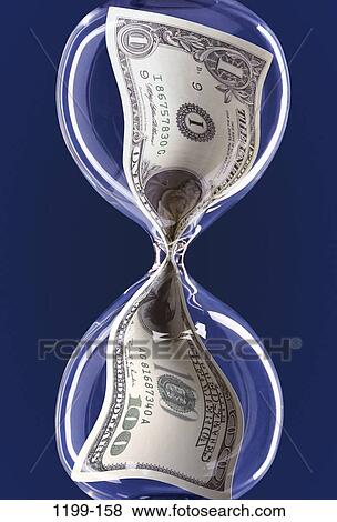 money, hourglass, finance, still life, dollar, metaphor, squeeze View Large Photo Image Stock Photo - money, hourglass, finance, still life, dollar, metaphor, squeeze. Fotosearch