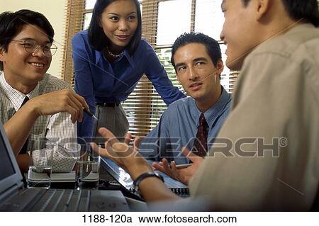 Stock Image - multiethnic, groups, discussion, shirtsleeves, gesturing, business, teamwork. Fotosearch