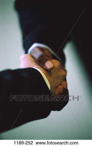 Stock Image - multiethnic, men, hands, contract, deal, business, greeting. Fotosearch