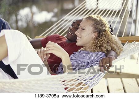 multiethnic, people, couple, hammock, outdoors, lying, married View Large Photo Image Stock Image - multiethnic, people, couple, hammock, outdoors, lying, married. Fotosearch