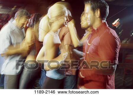 Stock Photograph - multiethnic, people, dancing, dance, nightlife, indoors, nightclub. Fotosearch