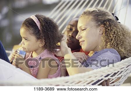 multiethnic, people, drinking, hammock, outdoors, family, juice View Large Photo Image Stock Photo - multiethnic, people, drinking, hammock, outdoors, family, juice. Fotosearch