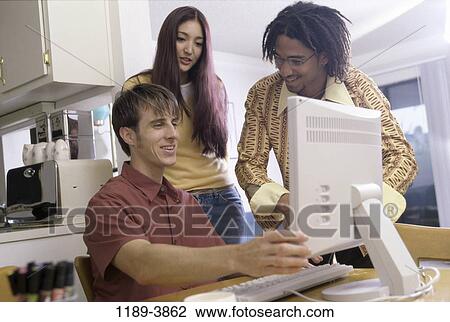 multiethnic, people, home, smiling, table, technology View Large Photo Image Stock Image - multiethnic, people, home, smiling, table, technology. Fotosearch