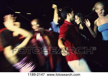 Stock Photo - multiethnic, people, party, dancing, dance, friends, nightlife. Fotosearch