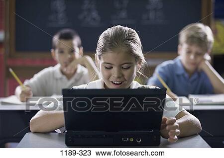 Stock Image - multiethnic, people, school, computer, laptop, classroom. Fotosearch