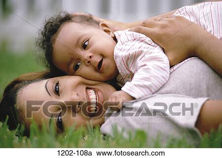 multiethnic, people, smiling, mother, baby, holding View Large Photo Image Stock Image - multiethnic, people, smiling, mother, baby, holding. Fotosearch