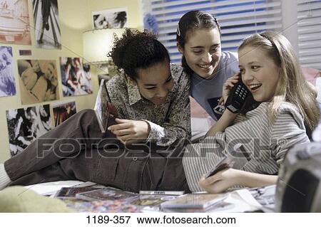 Stock Photo - multiethnic, people, smiling, telephone, listening, phone. Fotosearch