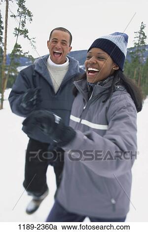 multiethnic, people, snow, couple, winter, happy, laughing View Large Photo Image Stock Image - multiethnic, people, snow, couple, winter, happy, laughing. Fotosearch