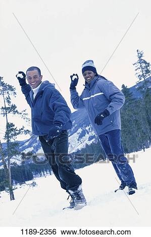 multiethnic, people, snow, couple, winter, cold, outdoors View Large Photo Image Stock Photograph - multiethnic, people, snow, couple, winter, cold, outdoors. Fotosearch