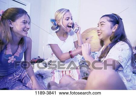 Stock Image - multiethnic, people, telephone, teens, indoors, female. Fotosearch