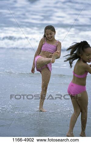 multiethnic, people, water, beach, splash, splashing, children View Large Photo Image Stock Image - multiethnic, people, water, beach, splash, splashing, children. Fotosearch