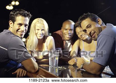 multiethnic, smiling, drinking, bar, friends, alcoholic View Large Photo Image Stock Image - multiethnic, smiling, drinking, bar, friends, alcoholic. Fotosearch