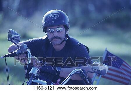 people, American, sitting, helmet, driving, motorcycle View Large Photo Image Stock Image - people, American, sitting, helmet, driving, motorcycle. Fotosearch