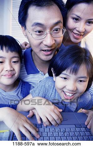 people, Asian, eyeglasses, computer, family, internet, together View Large Photo Image Stock Image - people, Asian, eyeglasses, computer, family, internet, together. Fotosearch