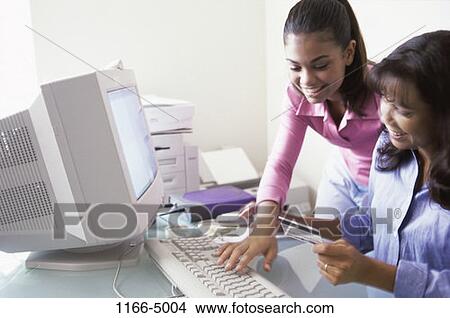 people, Asian, mother, Hispanic, computer, typing View Large Photo Image Picture - people, Asian, mother, Hispanic, computer, typing. Fotosearch