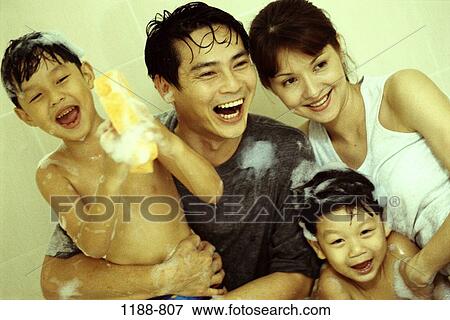 Stock Photo - people, Asian, soap, joyous, family, bath, wet. Fotosearch