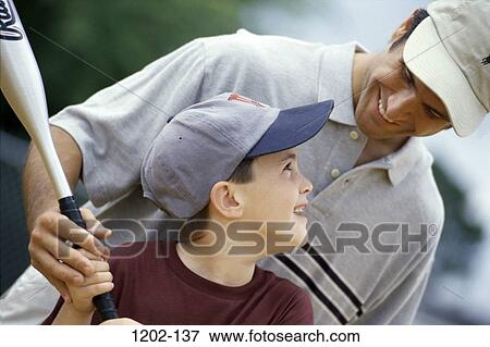 Stock Photo - people, bat, baseball, boy, father, male bonding. Fotosearch
