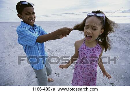 Stock Image - people, beach, hair, sunglasses, pulling, children. Fotosearch