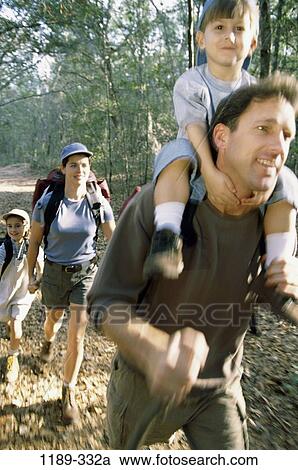 Stock Image - people, blur, walking, motion, outdoors, camping, family. Fotosearch