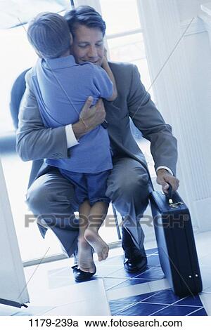 people, briefcase, blue, hugging, family, hug View Large Photo Image Stock Image - people, briefcase, blue, hugging, family, hug. Fotosearch