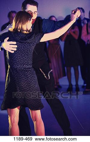 Stock Photo - people, clapping, couple, dancing, holding, dance, nightlife. Fotosearch