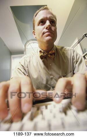 people, computer, typing, business, brunette, bow tie View Large Photo Image Stock Photo - people, computer, typing, business, brunette, bow tie. Fotosearch