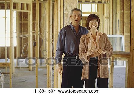 people, construction, home, building, moving, couple View Large Photo Image Stock Photo - people, construction, home, building, moving, couple. Fotosearch