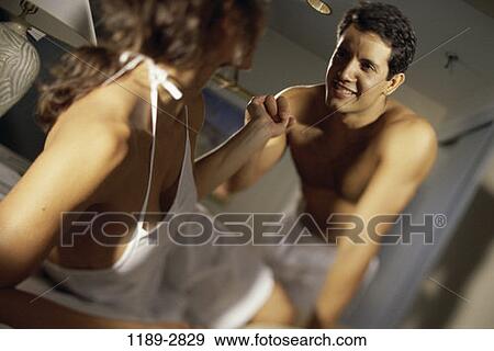 Stock Photo - people, couple, bed, romance, brunette, indoors, Caucasian. Fotosearch