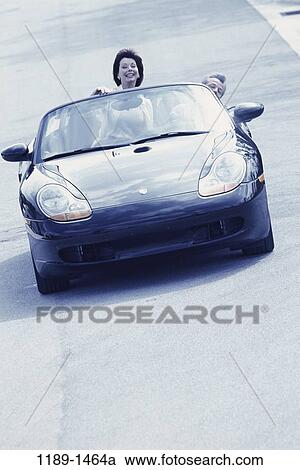 people, couple, car, driving, convertible, riding, playful View Large Photo Image Stock Image - people, couple, car, driving, convertible, riding, playful. Fotosearch
