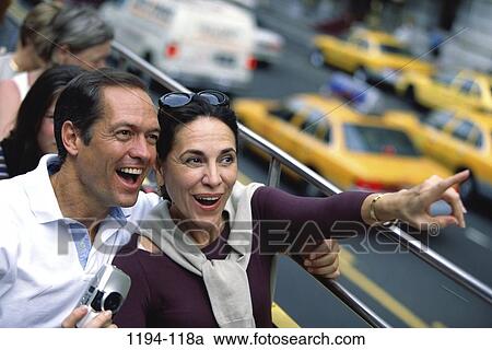 people, couple, city, riding, pointing, street, outdoors View Large Photo Image Stock Image - people, couple, city, riding, pointing, street, outdoors. Fotosearch