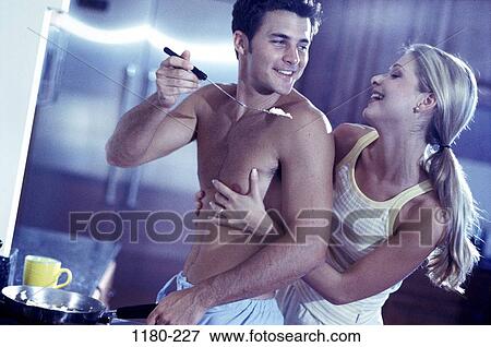 people, couple, cooking, flirting, curious, Middle-aged, hugging View Large Photo Image Stock Photo - people, couple, cooking, flirting, curious, Middle-aged, hugging. Fotosearch