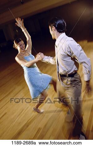 people, couple, dancing, swing, gesturing, dance, energetic View Large Photo Image Stock Image - people, couple, dancing, swing, gesturing, dance, energetic. Fotosearch