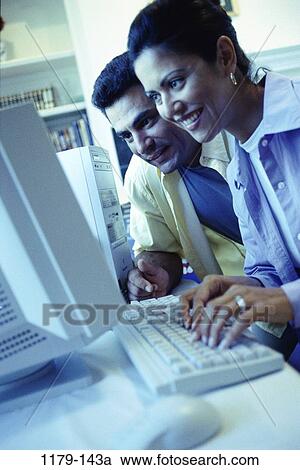 people, couple, Hispanic, blue, computer, typing, Middle-aged View Large Photo Image Stock Image - people, couple, Hispanic, blue, computer, typing, Middle-aged. Fotosearch