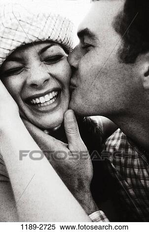 Stock Photography - people, couple, Hispanic, laughing, outdoors, hugging, commitment. Fotosearch