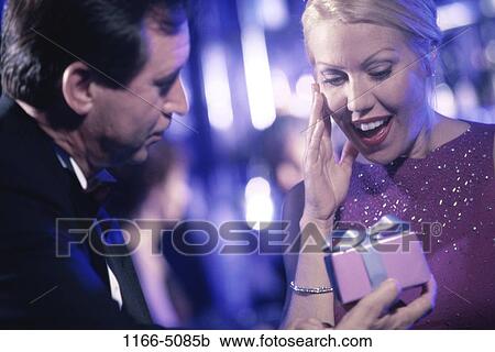 people, couple, Middle-aged, surprise, gift, present View Large Photo Image Stock Image - people, couple, Middle-aged, surprise, gift, present. Fotosearch