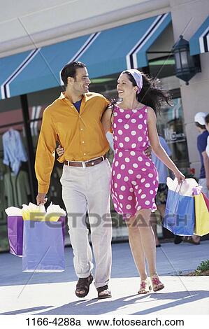 people, couple, outdoors, shopping, shop, shopping bags, brunette View Large Photo Image Stock Image - people, couple, outdoors, shopping, shop, shopping bags, brunette. Fotosearch