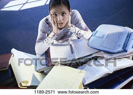people, desk, books, computer, laptop, overwhelmed View Large Photo Image Stock Image - people, desk, books, computer, laptop, overwhelmed. Fotosearch