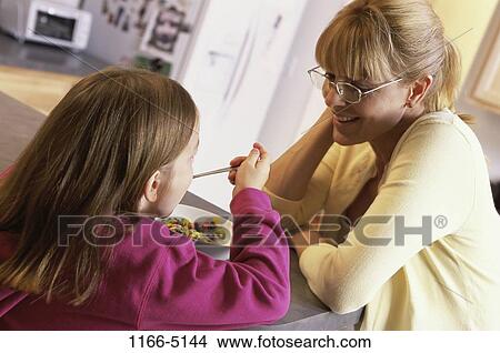 people, eating, morning, mother, spoon, bowl, watch View Large Photo Image Picture - people, eating, morning, mother, spoon, bowl, watch. Fotosearch