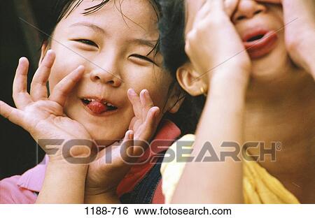 people, faces, Asian, children, humor, mischievous, carefree View Large Photo Image Stock Photograph - people, faces, Asian, children, humor, mischievous, carefree. Fotosearch