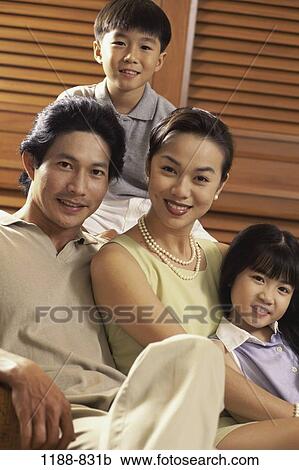 people, family, portrait, parents, indoors, Famlies indoors portrait View Large Photo Image Stock Image - people, family, portrait, parents, indoors, Famlies indoors portrait. Fotosearch