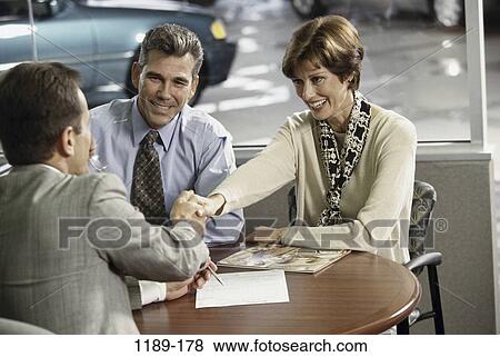 Stock Photo - people, hand, hands, smiling, couple, car. Fotosearch