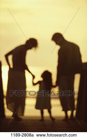people, hands, beach, holding, silhouette, family, daughter View Large Photo Image Stock Image - people, hands, beach, holding, silhouette, family, daughter. Fotosearch