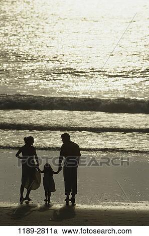 people, hands, water, walking, beach, holding, silhouette View Large Photo Image Stock Image - people, hands, water, walking, beach, holding, silhouette. Fotosearch