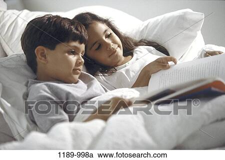 people, Hispanic, reading, bed, book, resting View Large Photo Image Stock Image - people, Hispanic, reading, bed, book, resting. Fotosearch