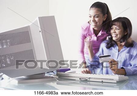 people, home, mother, Hispanic, computer, enthusiastic, shopping View Large Photo Image Stock Image - people, home, mother, Hispanic, computer, enthusiastic, shopping. Fotosearch