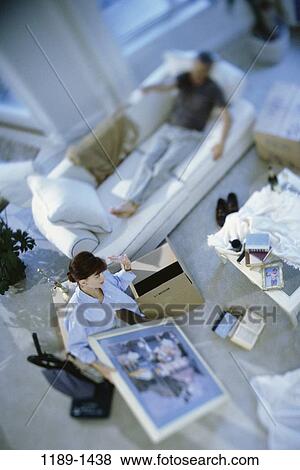 people, home, moving, couple, pack, couch, Middle-aged View Large Photo Image Stock Photo - people, home, moving, couple, pack, couch, Middle-aged. Fotosearch