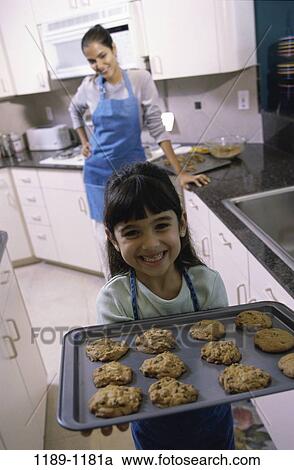 people, home, smiling, mother, Hispanic, cooking, achievement View Large Photo Image Stock Image - people, home, smiling, mother, Hispanic, cooking, achievement. Fotosearch