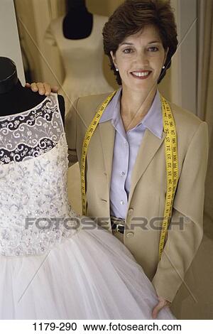 Stock Image - people, industry, woman, Hispanic, dress, business, Middle-aged. Fotosearch