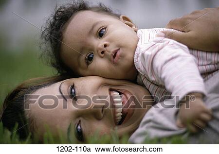 people, mother, baby, laughing, outdoors, family View Large Photo Image Stock Image - people, mother, baby, laughing, outdoors, family. Fotosearch